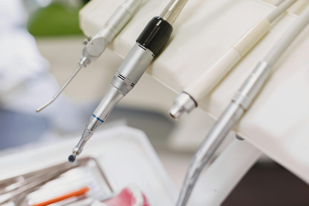 Detailed image of various dental instruments arranged in a dental clinic setting.